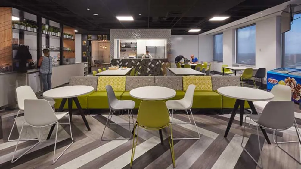 DDLS office dining room - a chef is visible in an open kitchen at the back of the room